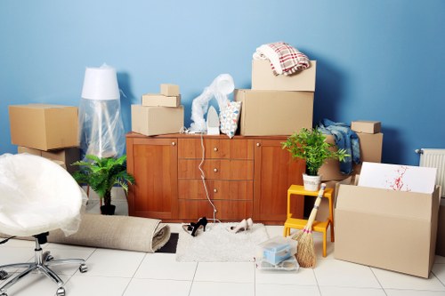 Relocation team moving furniture through a Hackney office building