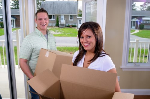Removal team carefully loading furniture with attention to safety procedures