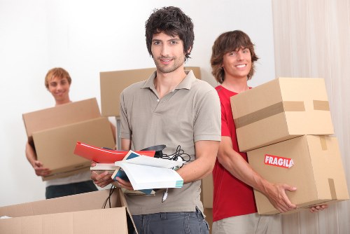 Moving boxes and furniture being loaded for a Hackney home removal