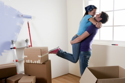 Professional movers loading items in an East London street