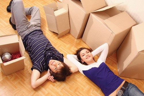 Loading household furniture into a van for a Hackney flat move
