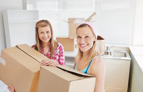 Loading household furniture into a removals van in Hackney