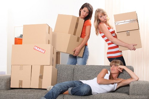 Boxes and furniture being loaded into a van for a Hackney move