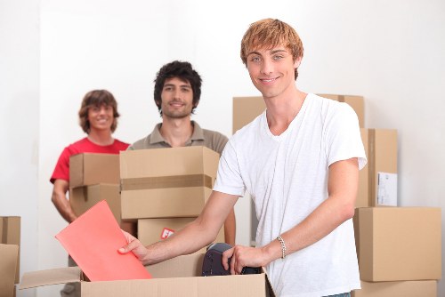 Packing boxes and preparing for a man with a van move in Hackney